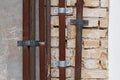 Old rusty metal pipes on brick and concrete wall Royalty Free Stock Photo