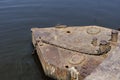 Old rusty metal pontoon with anchor chain and mooring bollards Royalty Free Stock Photo