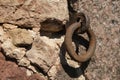 old rusty metal ring mounted in the wall close-up photo Royalty Free Stock Photo