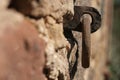 old rusty metal ring mounted in the wall close-up photo Royalty Free Stock Photo