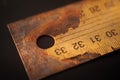 Old rusty metal ruler on black background surface Royalty Free Stock Photo