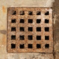 Old and rusty metal sewer lid Royalty Free Stock Photo