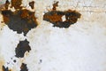 Old rusty metal surface with remnants of white colors Royalty Free Stock Photo