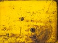 Old rusty metal texture painted with yellow paint Royalty Free Stock Photo
