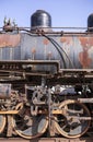 Old rusty iron parts of an antique steam engine