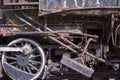 Old rusty iron wheels and pipes on an antique steam engine