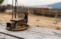 Old rusty metal vise on pine table Royalty Free Stock Photo