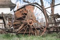 Old rusty metal wheel with spokes for work in agriculture Royalty Free Stock Photo