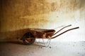 Old rusty metal wheelbarrow