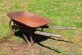 Old rusty metal wheelbarrow full of patina