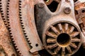 Old rusty metallic industrial gearwheel closeup