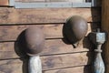 Old rusty military helmets hanging on the wall