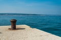 Old, rusty mooring bollard on port of Crikvenica, Croatia Royalty Free Stock Photo