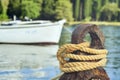 Old rusty mooring mast and rope Royalty Free Stock Photo