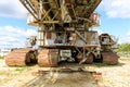 Old rusty multi bucket excavator, giant stacker, absetzer in sandy career