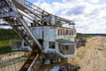 Old rusty multi bucket excavator, giant stacker, absetzer in sandy career