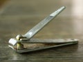Old rusty Nail clipper on wood texture background, Close up & Macro shot, Selective focus Royalty Free Stock Photo