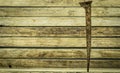 Old rusty nail on wooden background Royalty Free Stock Photo