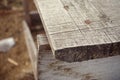 Old rusty nails driven into the Board, old wooden scaffolding. Wooden background, closeup with blur Royalty Free Stock Photo