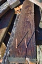 old rusty nails sticking out of wooden plank Royalty Free Stock Photo