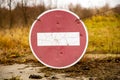 old rusty no entry sign on an old abandoned road in a field Royalty Free Stock Photo