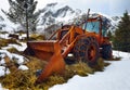 Old rusty Norwegian tractor with wheel chains. Royalty Free Stock Photo