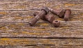 Old rusty nuts, bolts. Ancient tools. boards Royalty Free Stock Photo