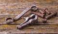 Old rusty nuts, bolts. Ancient tools. boards Royalty Free Stock Photo