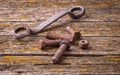 Old rusty nuts, bolts. Ancient tools. boards Royalty Free Stock Photo