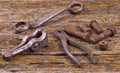 Old rusty nuts, bolts. Ancient tools. boards Royalty Free Stock Photo