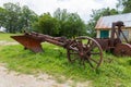 An old rusty one-bottomed iron plow for plowing the soil for vineyards Royalty Free Stock Photo