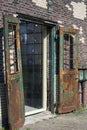 Old rusty open doors in the sunlight. Ancient doors