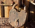 an old rusty open padlock hanging from an old fence Royalty Free Stock Photo