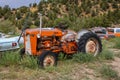 Old rusty orange colored vintage tractor Royalty Free Stock Photo