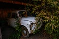 Old rusty overgrown abandoned soviet retro car