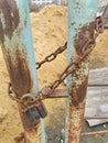 Old rusty padlock at closed gates Royalty Free Stock Photo