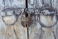 Old rusty padlock closes the same old gate Royalty Free Stock Photo