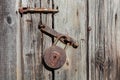 Old rusty padlock and latch on a wooden door Royalty Free Stock Photo