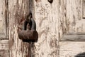 Old rusty padlock on old wooden door Royalty Free Stock Photo