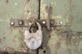 An old rusty padlock on a rusty metal door Royalty Free Stock Photo