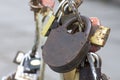 Old rusty padlock. It is a tradition to hang padlocks on the bridge after the wedding