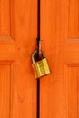 Old rusty padlock on white weathered wooden door Royalty Free Stock Photo