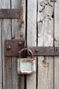 Old rusty padlock on wooden door Royalty Free Stock Photo