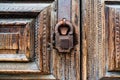 Old rusty padlock on an old wooden door close-up. Horizontal frame Royalty Free Stock Photo