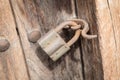 Old rusty padlock on a wooden door Royalty Free Stock Photo