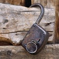 Old wooden gate, padlock and knives