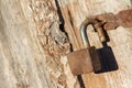 Old rusty padlock of an old wooden shed Royalty Free Stock Photo