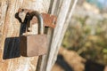 Old rusty padlock of an old wooden shed Royalty Free Stock Photo