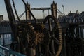 Old rusty parts of the coastal crane on the banks of the river i