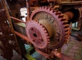 Old and rusty pinion gear of a machine in factory